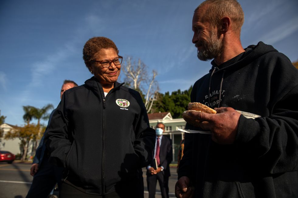 los angeles, ca february 16 mayor karen bass, left, chats with craig corbett, 44, a houseless person living under a tent behind academy museum of motion pictures on thursday, feb 16, 2023 in los angeles, ca irfan khan los angeles times via getty images